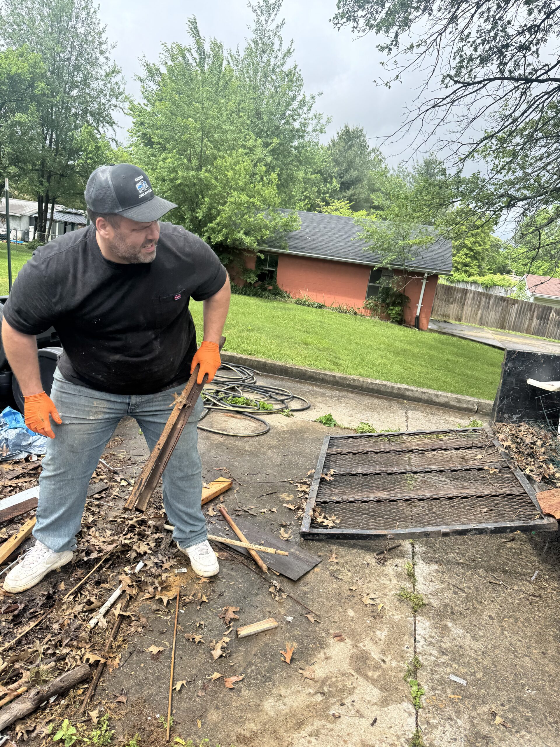 Garage cleanout by America Junk Busters with unwanted household items ready for removal